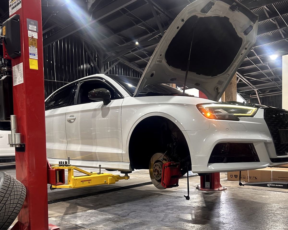 Audi on the lift for suspension repair at Bluegrass Precision Motorwerks