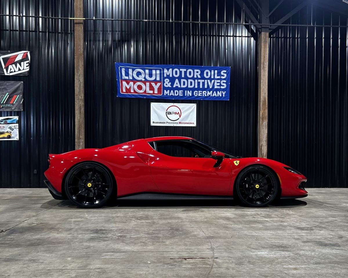 Red Ferrari in the shop at Bluegrass Precision Motorwerks