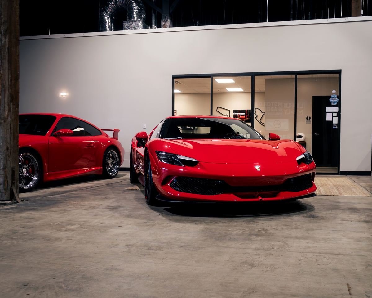 Red Ferrari and Porsche 911 at Bluegrass Precision Motorwerks, exotic car service in Lexington, KY