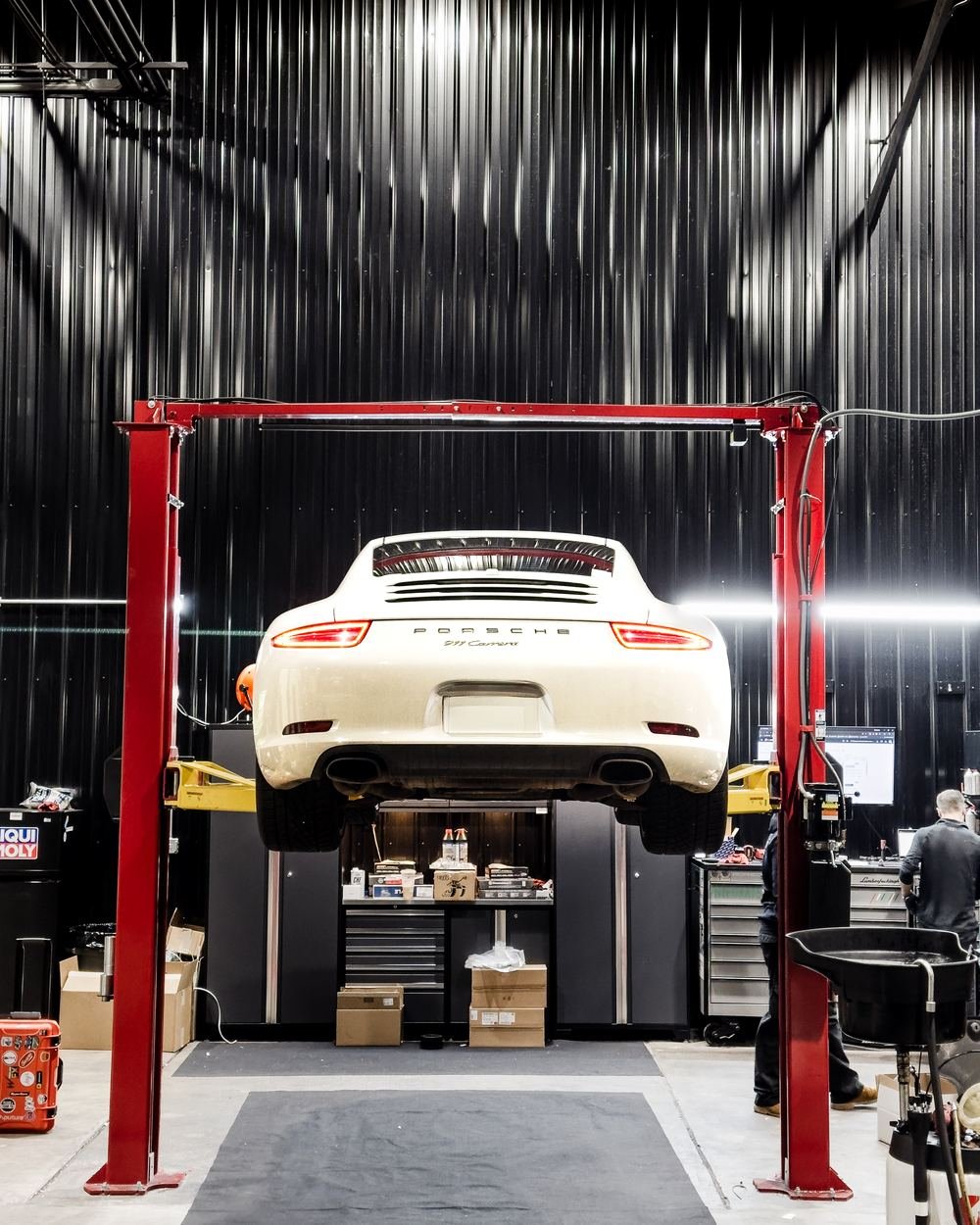 Porsche 911 Carrera on the lift at Bluegrass Precision Motorwerks in Lexington, KY