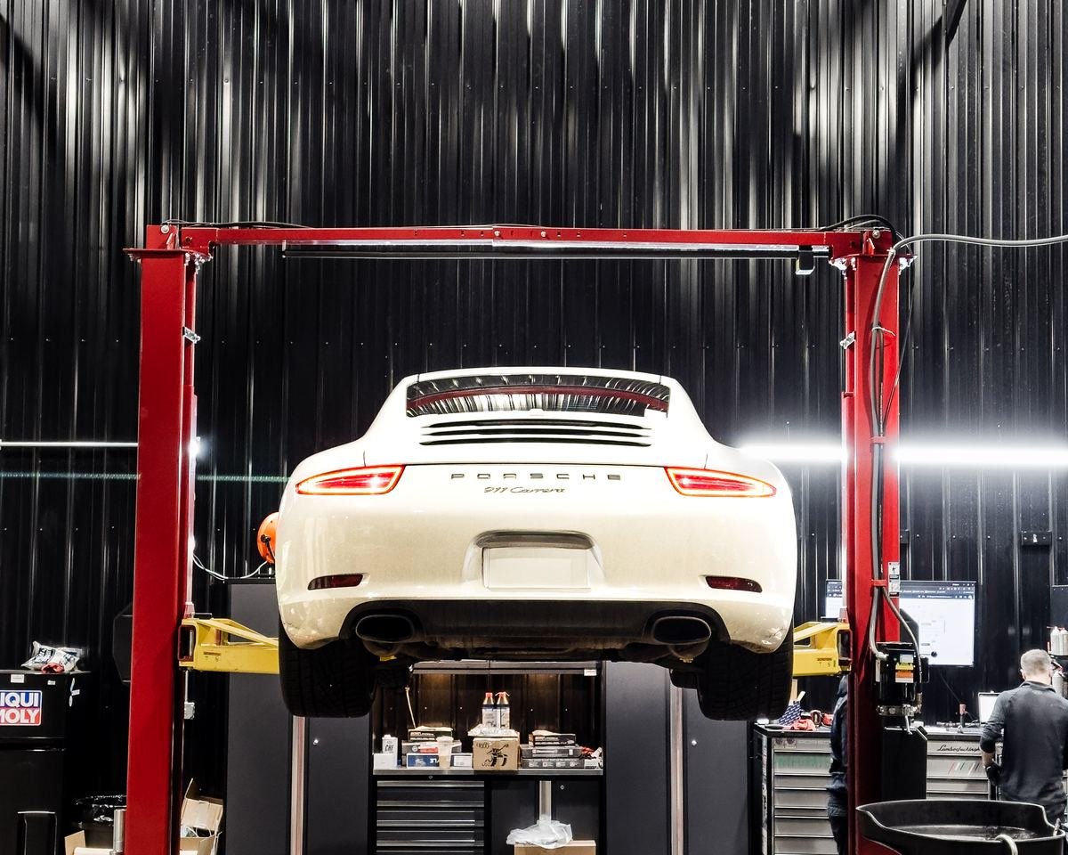 Porsche 911 Carrera raised on the lift for service in Lexington, KY