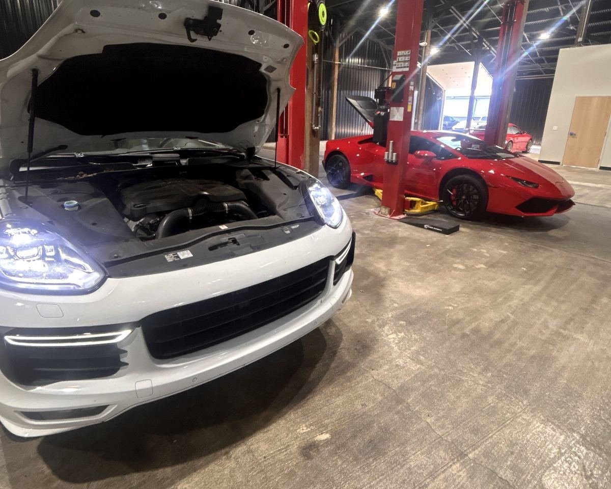 Porsche Cayenne with the hood open during service in Lexington, KY