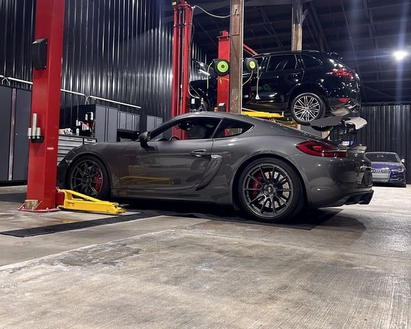 Porsche Cayman on the lift at Bluegrass Precision Motorwerks in Lexington, KY