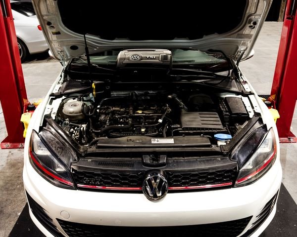 Volkswagen GTI engine bay during service at Bluegrass Precision Motorwerks